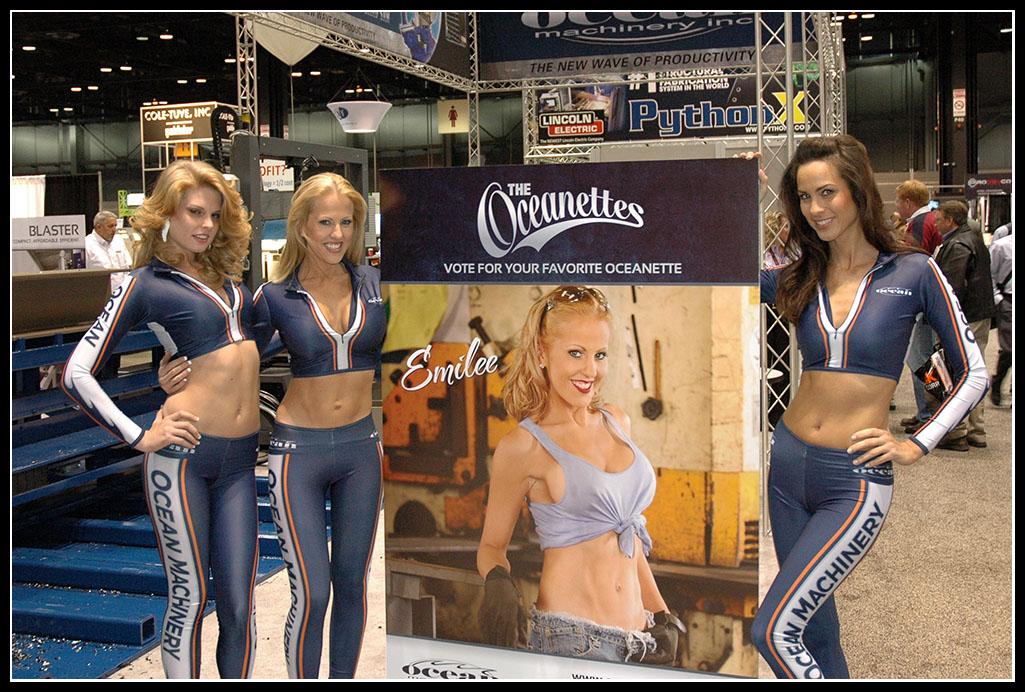 The word famous Oceanettes, Taylor, Emilyand Shannon with a lifesize poster of Emilee, the most popular Oceanette from the 2009 Oceanette Calendar